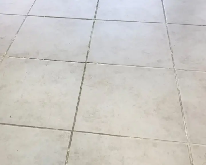 how to clean white film off shower tile